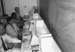 Former FSW Libraries staff and patrons at computers