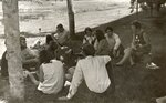 Class sitting in grass